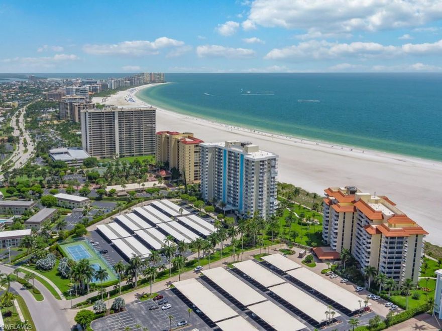 Enjoy beachfront living in this gorgeous Admiralty House residence!  This 1 bedroom, 1 and a half bath residence is tastefully appointed throughout and is offered turnkey furnished.  The great room floor plan provides ample natural light and plenty of space for entertaining.  The kitchen is well equipped with timeless cabinetry and granite counters.  The master bedroom features brand new carpet, access to the terrace, and ensuite bath.  The spacious terrace boasts stunning views of the City.  This is the perfect place to sit back and unwind while enjoying the gentle island breeze.  Impact sliders offer extra peace of mind.  Enjoy dedicated covered parking space with carport and private storage.  Admiralty House is located on Marco Island’s pristine white sand beach and offers newly renovated lobby, social room, library, heated beachfront pool, beach access, tennis courts, BBQ grills, car wash station, and lush tropical landscaping. Do not hesitate to make this beautiful residence your island oasis.