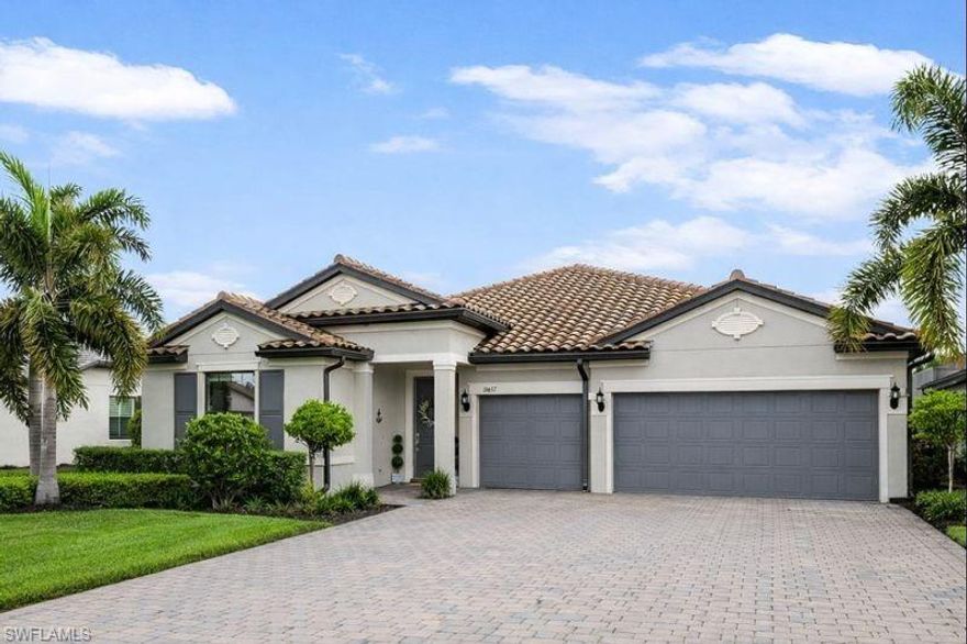 From the soaring 12' coffered ceilings to the engineered hardwood floors throughout, you're going to love your new Pulte "Creekview" from top to bottom! Your tray ceilings are adorned with real wood beams, making for a warm and inviting addition to the already light and airy home. Imagine the meals you can cook in your upgraded gourmet kitchen with built-in KitchenAid appliances, where family gathers around the expanded 9.5-foot center island. The finished pantry with built in floor to ceiling shelving, electric, and butcher block counters adds extra storage and convenience. Your primary suite at the back of the home offers the space and tranquility you need to unwind from the day.  Your custom closet offers practical storage with quartz counter, built-in dresser, separate laundry bins, and plenty of shelving. The finished laundry room offers quartz counter, sink, and soft close cabinets. An extra storage closet can be used as a wine cave, small craft room, or butler's pantry.  The three-car garage has added overhead storage as well.  The separate office/den area is large enough to be a 5th bedroom. Each of the 4 bedrooms and separate office has newly installed plantation shutters and gets plenty of sunshine year around.  Outside, your heated saltwater pool and spa is where you can relax among nature with your preserve view, privacy hedges and colorful bushes have been added for additional privacy. Additional features include: upgraded dimmable 5000k lighting and whole house water softener with reverse osmosis at kitchen sink.  The Place at Corkscrew has something for everyone at every stage of life. You'll have world-class amenities such as a resort-style pool with waterslide, splash pad, a full-service restaurant and bar, bourbon bar, marketplace cafe, 2-story state of the art gym with childcare, fitness classes, on-site masseuse, playground, dog park, pickleball, tennis, and pro shop.  Your new home is close to schools, shopping, beaches, and everything in between.