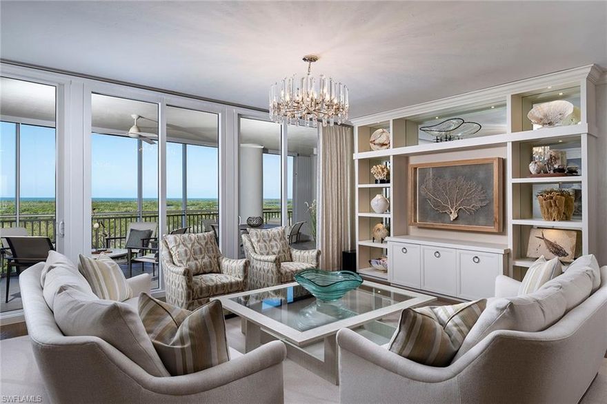 Discover refined living in this immaculately kept luxury condominium. Bathed in beautiful natural light, the home showcases wide-plank wood floors, sophisticated Venetian plaster walls, and 8-foot solid core doors that emphasize quality craftsmanship throughout. The open floor plan is enhanced by 10-foot ceilings with elegant drop detailing to define each space, creating a warm and inviting flow. Entertain in style in the expansive kitchen, with Sub-Zero, Wolf and Miele appliances, a five-burner gas cooktop, two dishwashers, and soft-close drawers and cabinets. With two distinct counter seating areas, meal prep and hosting are effortless. Additional features include a private elevator foyer for an exclusive entrance, Soft-touch Lutron lighting to set the ambiance in every room, a wrap-around front balcony with sweeping views of the golf course and rear screened lanai overlooking the marina, complete with a built-in grill and storm shutters. Enjoy two secured garage spaces and ample additional storage for ultimate convenience. With extraordinary attention to detail and thoughtful design, this condominium is move-in ready and ideal for those seeking luxury, comfort and style in every aspect.