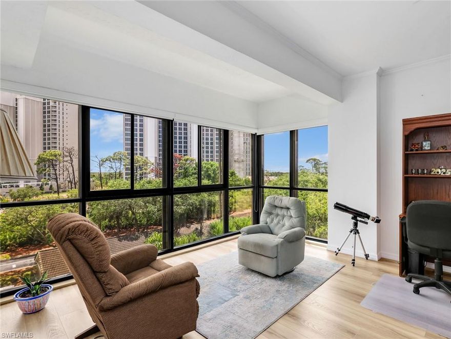 Discover refined living in this beautifully reimagined Banyan floor plan, where thoughtful design meets modern elegance. This expansive 2-bedroom plus den, 2.5-bath residence showcases high-end finishes and meticulous upgrades throughout. The chef-inspired kitchen is a true centerpiece, featuring sleek quartz countertops, premium stainless steel appliances, a stylish glass subway tile backsplash, and custom cabinetry enhanced with crown molding. Contemporary LED lighting and plantation shutters add both sophistication and functionality, while a newly installed air conditioning system ensures year-round comfort.

The interior is adorned with durable and visually striking engineered vinyl plank flooring complemented by tile in key areas, creating a seamless and polished look across the home. The versatile den offers the perfect space for a home office, reading lounge, or guest overflow, catering to a variety of lifestyle needs. Included with the residence is a pristine, dedicated garage space, providing both convenience and security.

Residents of Arbor Trace enjoy access to an exceptional array of resort-style amenities designed to enrich daily living. Spend your days relaxing by the sparkling pool, staying active on the tennis and bocce courts, or perfecting your short game on the putting green. The vibrant community also offers a full calendar of social events and fine dining experiences at the elegant clubhouse.

Adding to the appeal is a comprehensive suite of supportive services, including 24-hour medical monitoring, scheduled transportation for appointments, shopping, and organized outings—designed to provide comfort and convenience at every stage of life. Arbor Trace stands apart with its rare deeded condominium ownership structure, offering full equity with no financial or medical entry requirements. Owners enjoy complete flexibility, with the ability to lease, sell, or transfer ownership to heirs.

With the added reassurance of an on-site continuum of care, this residence delivers not only luxury and style, but also long-term peace of mind in a welcoming and well-established community.