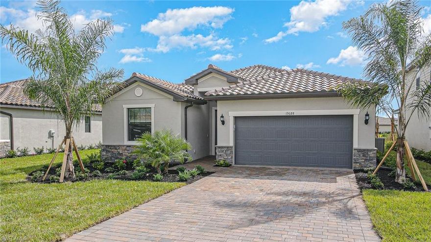 You’ll fall in love with this gorgeous brand-new home from the minute you pull into your pavered driveway and take in the sophisticated, colorful facade of stucco and stone.  This 4 bed, 3 bath home in the highly desirable neighborhood of The Place at Corkscrew has never been lived in and features 2032 sq ft of living space with a roomy lanai where you’ll love watching the breathtaking sunsets over the stunning littoral preserve and still have room for the pool of your dreams.  The open and airy great room shares the view and lets in plenty of natural light with plenty of space for living and dining.  The striking kitchen features beautiful, white shaker cabinets with granite countertops, ss appliances, and a large island perfectly situated for entertaining.  Imagine waking up in the generous main bedroom, then making your way to the spacious ensuite with dual sinks, a large glass-enclosed shower, and a double walk-in closet. Three guest bedrooms, one with a private bath, and an additional, nicely appointed bathroom round out this majestic home in this amazing neighborhood. The Place at Corkscrew also boasts a myriad of resort-style amenities to fit your every want!