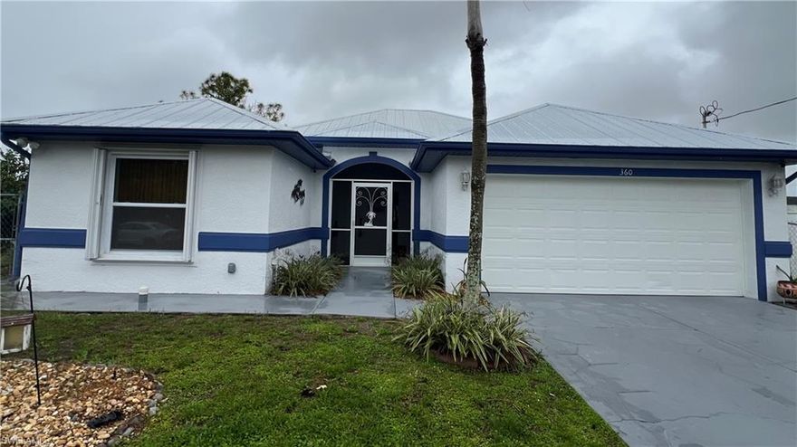 Welcome to your dream home in the heart of Lehigh Acres! This stunning single-family home has 3 bedrooms, 2 bathrooms, and a spacious 2-car garage. The interior features granite counters, stainless steel appliances, tile flooring in the main and wood flooring in the bedrooms adds a touch of warmth and elegance to the space. With a new metal roof and recent remodeling, this home is move-in ready and waiting for you to make it your own. The added bonus of a generator exterior hook up ensures peace of mind during any power outages. 

The property also includes an efficiency unit, perfect for generating extra income or hosting guests. Hurricane accordion shutters provide added protection during storm season, while the outdoor kitchen is perfect for entertaining friends and family. 

Additionally, a security system offers added peace of mind for you and your loved ones. Don't miss out on the opportunity to own this beautiful home in a desirable location.