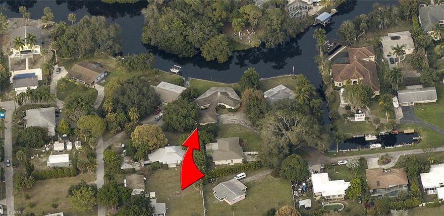 Mesmerizing RIVER Views Abound from the Wrap-Around Lanai. This Well-Built Home is Nestled on an OVER-SIZED Estate Lot complete with Seawall for Your Impromptu Boating Adventures to the Gulf of Mexico.
Just grab Your Fishing Pole & Picnic Basket for a Fun-Filled Day of Heart-Warming Memory Making that will Delight for a Lifetime. Life is Short, Start Living Your Dream NOW!
 PLEASE CHECK OUT THE DETACHED 3 CAR GARAGE TOO.   
This Home is VERY EASY to Show.