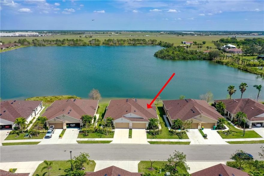 Beautiful lake views are at one of the newest homes in Tuscany Isles, with a larger living room, dining area and kitchen than most of the villas. Turn-Key ready with only a few items excluded! This gated community is only 2 miles from the heart of downtown Punta Gorda. Enjoy living without daily home maintenance, while still having an attached 2-CAR GARAGE and an open floor plan that flows so beautifully and opens up to the lakefront lanai. You will be impressed with three spacious bedrooms and the privacy of the two guest bedrooms and hall bathroom.  There is plenty of storage in the pantry, walk-in closet and laundry room. This villa has accordion hurricane shutters, a garage sink and a water filtration system. The lanai can be enclosed. Sidewalk access makes it easy to enjoy the gorgeous waterfront swimming pool and clubhouse. Punta Gorda's 2.5 mile harborwalk, pickleball courts, farmer's markets, boutiques, restaurants and the Punta Gorda airport are a short dirve away. The homeowner's association fee covers building repair and maintenance, some landscaping, pool maintenance, gated entrance and exit, reserves, and more. Enjoy convenient easy living with a beautiful lake view!