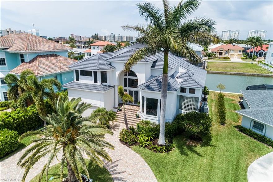 Newly renovated coastal contemporary retreat with SOARING ceilings now available in North Naples’ coveted Gulf-access community of Conners at Vanderbilt Beach. Offers the best of both worlds—BEACH & BOATING! Enjoy a 5-minute bike ride to Vanderbilt Beach/the Gulf of Mexico PLUS direct Gulf access in 5-minutes from your 10,000 lb. boat dock & lift! This home maximizes the breathtaking water views with soaring high ceilings & ample walls of windows, bathing the home in gorgeous natural light throughout. This spacious 5-bedroom home is light, neutral & coastal with a NEW ROOF IN 2021, NEW WOOD FLOORS, NEW IMPACT SLIDERS, NEWLY RENOVATED COASTAL CONTEMPORARY KITCHEN & FULLY RENOVATED MASTER BATH & GUEST BATHS! Chef’s kitchen is fully renovated & features quartz counters, beautiful white cabinetry & a walk-in pantry. Boasts a fantastic new outdoor entertaining deck with large renovated pool, spa & ample space to relax and enjoy the Bay breezes. Excellent floor plan offers split bedrooms, spacious master suite & huge amounts of storage. Conners is perfectly located minutes to Mercato, Waterside Shops & convenient to 5th Ave downtown with easy access to RSW International Airport.