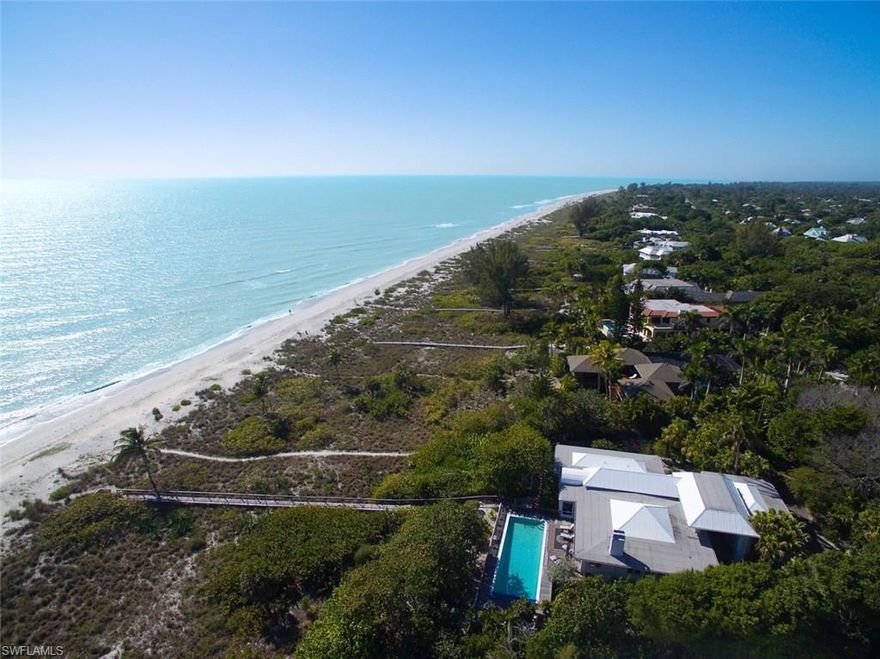 A Special Beach Front Property w/ 138 ft +/- of Frontage. This awesome 4 Bedroom refurbished residence sits perfectly angled towards the west, capturing beautiful sunsets. The oversized lot offers the perfect topography so the home feels almost ground level due to the ridge this property enjoys. The flow of the homes interior brings the outside in and features a large open raised pool area that connects to a private beach boardwalk. A spacious split bedroom floor plan that lives casual but upscale with lots of natural light to enjoy. The master br and guest suites are very generous and are all on one level. This home features great character and is the perfect beach house, one you will definitely appreciate and fall in love with.