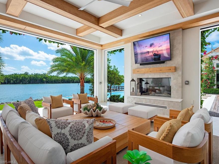 This Port Royal Estate has achieved unparalleled recognition by achieving not just one, but 5 prestigious Sand Dollar Awards, the most notable being the highly sought-after Product Design of the Year award. This is an incredible opportunity to own a masterfully designed custom Port Royal home, perfectly positioned on an oversized lot and half with a remarkable 177’ of water frontage. Featuring highly desirable and rarely available southern exposure, this breathtaking estate was built in 2024 by Knauf- Koenig Group and designed by Kukk Architecture to the highest possible standards and specifications. Exquisitely appointed with materials imported from around the world, the light-filled home offers the utmost in privacy and comfort with spectacular and expansive views of Naples Bay. This visually stunning residence sets a new standard for ultra-luxury properties in Naples. At over 11,500 square feet, the home feels like a true oasis, offering incredible amenities including an exercise room, studio, luxurious second floor spa, and more. The vast exterior living space features a stunning outdoor kitchen, a beautiful al fresco dining area, BBQ grill, multiple fire pits, one with a large seating area, enormous infinity edge pool and relaxing spa. This magnificent residence is a true one-of-a-kind offering the best of the Naples luxury lifestyle for the most discerning client.