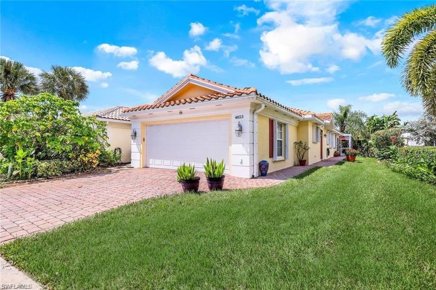 **ISLANDWALK NAPLES** This is the one you've been waiting for! Fabulous "Capri" villa in the highly desirable Island Walk neighborhood in North Naples. This beautiful, move-in ready villa has a newer roof & gutters, hurricane proof garage door, accordion hurricane shutters, granite counters in the kitchen, baths & laundry, pull-out drawers in the kitchen and laundry, newer exterior paint and a new washer and dryer. Outside is an extended tiled lanai with pergola & covered outdoor area w/built-in granite counters w/white cabinetry and a preserve view of a beautiful garden. Other features include stainless steel appliances, plantation shutters, tile & luxury vinyl flooring, walk-in tub w/jets & heater in primary bathroom, built-in storage cabinets in the laundry room & garage and central vac. Island Walk is a resort-style community and town center clubhouse with state of the art fitness center, two community pools, tennis & pickle ball, putting green, bocce courts, gas station, car wash, hair & nail salon, post office & on-site restaurant. Close to beaches, shopping, restaurants, hospitals and convenient to SWFL Airport!