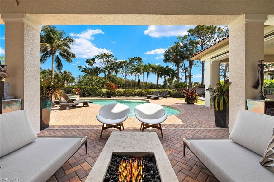 Introducing the stunning Estrella floor plan in the prestigious Marsala at Tiburon, a beautiful home with over 4,400 square feet of luxurious living space with two bedrooms on the main level and 2 two bedrooms upstairs. This exquisite property features a custom pool and spa, complete with gas heating and a salt chlorinator, set in an inviting outdoor oasis designed for entertaining. Enjoy the outdoor summer kitchen, which includes a gas grill, sink, and refrigerator, perfect for hosting friends and family. Nestled in a natural gas community, this home boasts a kitchen equipped with a Wolf stovetop, a Sub-Zero refrigerator, and a wine fridge, as well as a new Bosch dishwasher. The new tankless gas hot water heater ensures continuous and efficient hot water supply, while the newer washer and dryer add convenience to everyday living.  For wine enthusiasts, a dedicated wine room awaits, providing an ideal space to store and display your collection. The property offers breathtaking views of the 12th green and fairway of the Tiburon Black Course, adding a picturesque backdrop to your daily life. With Tesla Powerwalls installed, you can rest assured that the entire house will remain powered during any outages. Additionally, the home comes with new garage door openers for added peace of mind. The open floor plan seamlessly blends modern design with inviting decor, creating a sophisticated yet welcoming atmosphere. Featuring 4 spacious bedrooms, all with ensuite bathrooms, a den, pool bath, and 3 car garage. This exceptional home is the epitome of luxury living in one of Tiburon's most sought-after communities. Tiburon boasts 36 holes of Greg Norman-designed championship golf, concierge services, restaurants, fitness center, spa, tennis and private beach shuttle. Tiburon is located close to beaches, world-class shopping and dining. GOLF MEMBERSHIPS are IMMEDIATELY available, but not required to live in the community. Just 3 miles to Vanderbilt Beach and 1.5 miles to the shops and restaurants at Mercato. Don't miss the opportunity to make it your own!