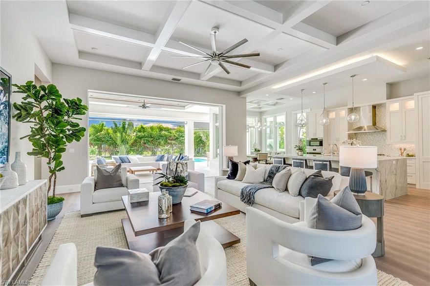 Just completed. Incomparable Coastal West Indies style retreat with preferred southern exposure. 4400 square feet includes four bedrooms and den, 6 bathrooms, 4 car garage and is graced by French Oak hardwood floors, custom millwork, a gourmet kitchen with Wolf and Sub Zero, automated roll down screens and shutters, phenomenal outdoor resort-style amenities, and more to promise a truly authentic, rare and phenomenal handcrafted generational estate in The Moorings. The home is exceptionally bright throughout and offers an ideal layout perfect for entertaining including seamless indoor to outdoor integration. Perfectly placed, in a quiet enclave of the Moorings on a very large lot(.43 Acres) only a short stroll to the private Moorings Beach Park this remarkable home without a doubt is the best opportunity for new construction West of 41.