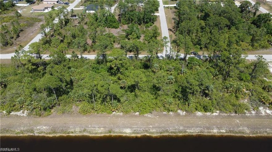 Discover the perfect opportunity to build your dream home or invest in the fast-growing community of Lehigh Acres. This beautiful vacant lot sits directly on a canal, offering peaceful water views and added privacy. Whether you're looking to create a custom home or add to your investment portfolio, this property has endless potential. Located near shopping, dining, schools, and major roads, it offers convenience while still maintaining a quiet, residential feel. With new construction happening all around, this is a great time to secure your spot in one of Southwest Florida’s up-and-coming areas.