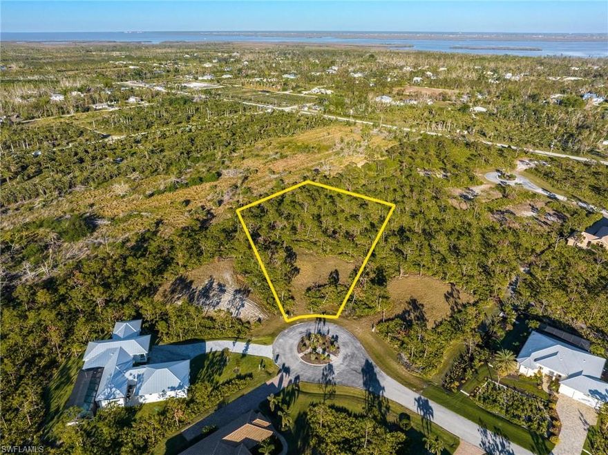 Welcome to Calusa Ridge!  OVERSIZED LOT - 1.46 ACRES! NO HURRICANE DAMAGE, NO FLOODING! 12-17 FT. ABOVE SEA LEVEL. NO FLOOD INSURANCE REQUIRED! SELLER FINANCING AVAILABLE!  This premier development is located is Bokeelia, Florida on Pine Island and is a gated community.  The. community consist of 45 lots most of which have been developed with custom homes and each lot has an average size of one acre. The amenities that this area offers is abundant. Within a few miles drive miles drive you have several marinas, fishing piers and numerous restaurants to choose from. Whether is kayaking the mangroves, a quick trip to Cayo Costa, Florida’s best rated state park, or just enjoying Bokeelia’s spectacular sunsets and stargazing, this lot has it all.  This oversized front western exposed lot features 1.46 acres and is situated within a nature preserve. While living on the preserve, you can enjoy nature’s untouched beauty. A portion of this lot is dedicated to a gopher tortoise preserve. I encourage you take the drive to this beautiful piece of paradise.  You will not be disappointed.