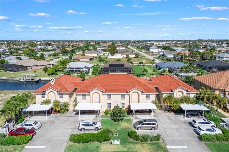 This stunning 3 bedroom 2 bath Gulf access condo offers a rare opportunity to own a condo with a deeded boat slip and a 10,000 lb boat lift with Gem Remote Control, new motors and pilings in 2023 costing $12,787 that will accommodate up to a 23’ boat. Located in the highly sought-after section of Cape Coral, this property is just one bridge away from the river leading to the Gulf, making it a boater's paradise. Conveniently situated near Cape Harbor and Tarpon Point, as well as within walking distance to shopping and restaurants, this second-floor stand-alone building provides privacy with no neighbors sharing walls on any side.

The lanai is positioned away from the building for privacy. This is one of two condos that are stand-alone second floors with no neighbors on either side and has more windows for additional light.

The condo features windows on all four walls and in both bathrooms, allowing for an abundance of natural light and breezes. Vaulted ceilings in the kitchen, living area, and Coffered ceiling in Master bedroom create an open and airy atmosphere. New LVT flooring in the living room, kitchen and guest bathroom and new blinds on all windows. The lanai has new screens and provides great airflow. The split bedroom floor plan offers privacy, with a large master bedroom featuring sliders to the lanai overlooking the canal, boat slip, and pool. The master bath includes granite counters, dual sinks, a walk-in closet, separate jetted tub, separate water closet, and a spacious walk-in shower. Two additional guest bedrooms and a guest bathroom with solid surface counters, tub, and shower complete the living space.


The well-equipped kitchen offers solid surface counters and stainless steel appliances, including a new refrigerator in 2025. An in-unit laundry closet includes a washer, dryer, and water heater from 2017. Roll down shutters on all windows and electric shutters in the lanai provide easy storm protection. The complex, consisting of only eight units, shares a heated community pool, spa/hot tub, BBQ area, Tiki on Dock with lounging area, bar area on the pool deck and Happy Hour at Five O'clock every day beverages not included.

Recent upgrades include a new composite tile roof in 2023 with 30 year warranty, central AC & heat in 2021 with a new compressor in 2025. The condo also comes with two assigned parking spaces and a storage shed. Not a 55 and over condo all ages Welcome and Pet Friendly