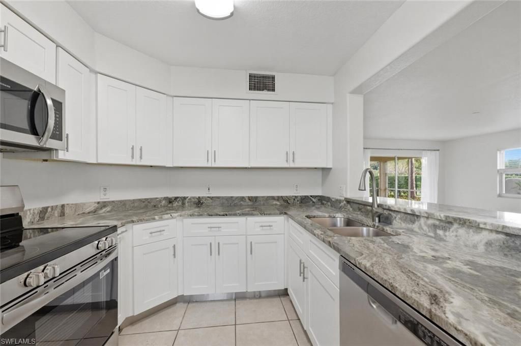 Photo of 9570 Crescent Garden DR #A102, NAPLES, FL 34109 (MLS # 226010383)