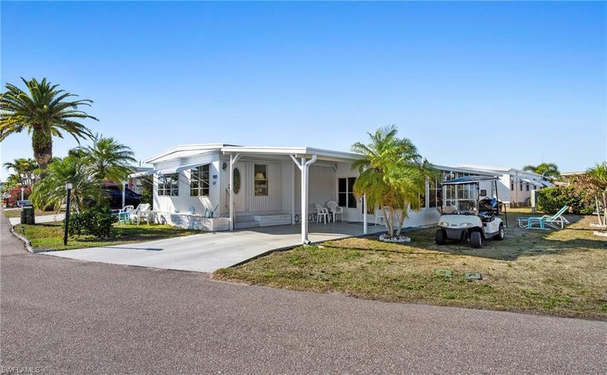 Fully furnished manufactured home in a 55+ waterfront gulf access community in North Fort Myers, FL. This turnkey retreat features a bright, open-concept kitchen and dining area, not one but two living area and stylish Florida decor. The two-bedroom, two-bath layout includes a large master suite and en-suite bath.  Enjoy mornings on a private enclosed lanai with peaceful canal or water views and easy access to boating, fishing, and social amenities. Set within a guard-gated, golf-cart-friendly community, residents enjoy a clubhouse, pool, fitness center, pickleball/tennis courts, and a lively social calendar, boat storage and direct access to the Caloosahatchee River. This low-maintenance home is perfectly suited for snowbirds or full-time or part time residents seeking waterfront access, resort-style amenities, and a turnkey Florida lifestyle. Schedule a private tour to see all that this home and community have to offer.