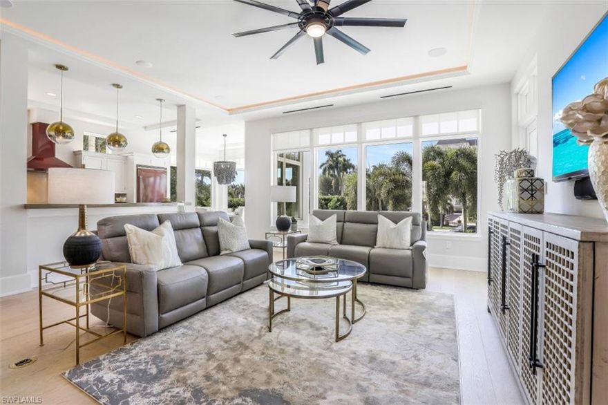 H2320  Enjoy living in a spacious SF home with a large private pool and spa!! Now w/Brand New Furniture available for separate purchase! PRIVATE BEACH ACCESS, 35' BOAT DOCK IN BACKYARD, WESTERN SUNSET VIEWS! Solid concrete top to bottom - 2 story over parking-over 4,100 sq ft  AC (4 bedroom + Den 3 1/2 baths. Bright W sunset view exposures + bonus partial Gulf views from multiple large impact picturesque windows (automated window shades) & tall French impact glass doors. Great room plan offers a 3 stop elevator & towering 4th level observation terrace to delight in scenic, romantic white sand beach views with sizzling sunsets, holiday fireworks and private sun basking! Volume ceilings, wet bar, breakfast bar, wide plank oak wood flooring, 4 car+ garage, open (gas cooking) kitchen, breakfast bar & scenic sunset dining area! Lanai  sunset views - large bedrooms include outdoor balconies again with Western views!  Dual master bathrooms flaunt bright mesmerizing W views plus his/hers closets w/ quality custom cabinets. Western facing private pool w/spa, Aqualink system and covered dining/gathering.