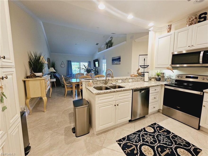 Welcome to your oasis in the heart of Cape Coral, FL nestled in the serene community of Casa Di Fiori. This charming 3 bed/2 bath/1 car garage end unit condo offers comfort, convenience, and a touch of luxury. The kitchen boasts modern stainless steel  appliances, ample granite counter top space, a breakfast bar and stylish cabinetry, providing the ideal setting for culinary adventures. Whether you're preparing a gourmet meal or enjoying a casual breakfast, this kitchen caters to your every need. Retreat to the spacious bedroom where tranquility awaits, with plush carpeting, sliders to leading to your screened lanai and a soothing décor, it's a peaceful sanctuary to unwind after a long day. The adjacent bathroom features a granite vanity with dual sinks, a tiled walk in shower & a large walk in closet adding a touch of elegance to your daily routine. Step outside to your private balcony, where you can sip your morning coffee or enjoy an evening cocktail amidst lush greenery and gentle breezes. This condo comes with a murphy bed/desk in the guest bedroom, washer/dryer, crown molding throughout, volume and tray ceilings, diagonal set 18" tile in the main living areas, a screened lanai & a Halo whole house in duct air purifier system that reduces bacteria, viruses, odors and mold spores in the air and on surfaces. As part of the community amenities, residents enjoy access to a sparkling swimming pool & spa, 4400 square foot clubhouse with a large catering kitchen & dining area, billiards, a fully equipped fitness center and tennis/pickleball courts, providing endless opportunities for recreation and relaxation. Located in the heart of Cape Coral, this condo offers unparalleled convenience. Shopping, dining and entertainment are just minutes away, ensuring you're never far from the action.  Don't miss your chance to experience the best of Cape Coral living. Schedule your showing today and make this condo your new home sweet home.