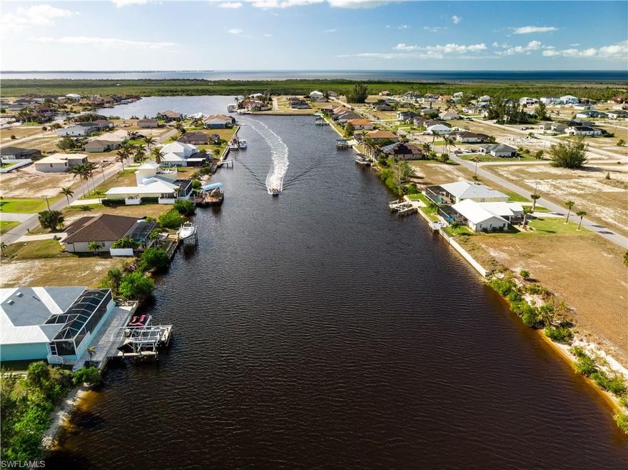 One of the very FEW SOUTHERN exposure lots available on a massive 250ft+ canal with the NEW TALLER 10FT SEAWALL ALREADY INSTALLED! SELLER FINANCING maybe available. Don’t miss this extraordinary opportunity to own this DIRECT SAILBOAT Gulf Access lot in the very desirable NW Cape Coral. Boaters will love the direct, bridge-free Gulf access, offering endless adventures to Pine Island Sound, Sanibel, and other tropical destinations. Build your dream home in this peaceful, up-and-coming neighborhood surrounded by luxury custom homes and enjoy stunning waterfront views every day. Conveniently located near the future popular 7 Islands Project, Crystal Lake Park, Coral Oaks Golf Course, and top-notch dining and shopping, this property is perfect for those seeking the ultimate Florida lifestyle. Whether you’re looking for a serene retreat or a boater’s paradise, this lot is your chance to create a one-of-a-kind waterfront haven. Floor plans available at your request. Act quickly—opportunities like this don’t last long!