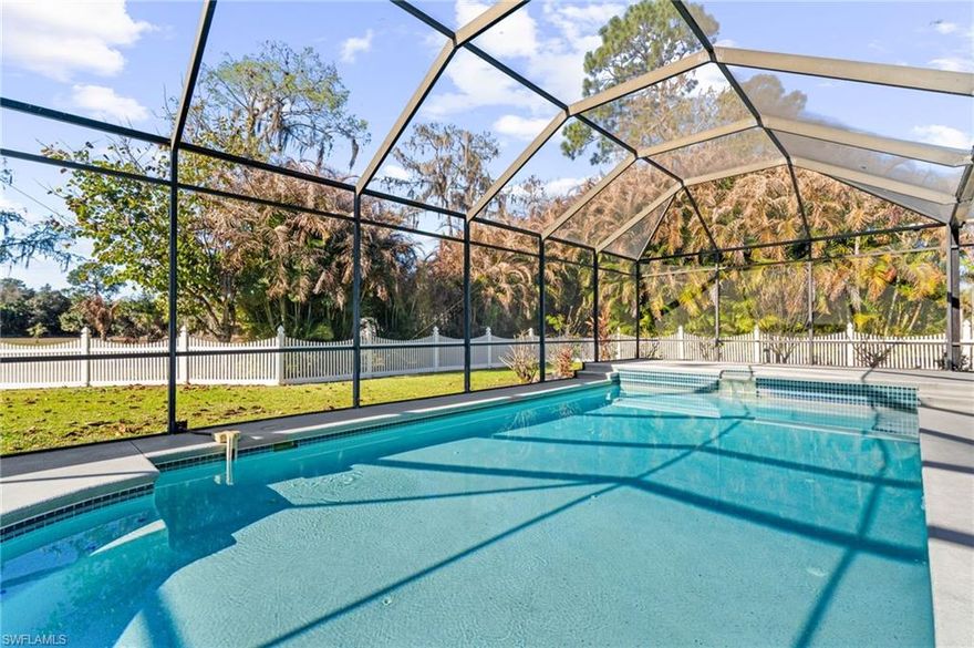 5 PRIVATE ACRES – OVERSIZED SALTWATER HEATED POOL – DUAL GARAGES FOR 6+ CARS – ZONING ALLOWS GUEST HOME OR ADDITIONAL UNIT! Welcome to 360 16th Avenue NW, Naples — a rare opportunity in Golden Gate Estates offering both immediate comfort and exceptional long-term potential. This expansive and highly private five-acre parcel is thoughtfully cleared while preserving beautiful native Florida trees that provide shade, character, and a natural backdrop. The existing residence features three bedrooms, two and a half baths, a Florida room, and a screened oversized saltwater/chlorine pool with heater, delivering comfortable livability as you envision future possibilities. Storage and functionality are unmatched with two garages — one attached and one detached — accommodating up to six vehicles, perfect for car enthusiasts, contractors, hobbyists, or those needing extra workspace. Updates include new kitchen appliances, refrigerator, and garbage disposal, as well as attic AC insulation completely redone in the past two years. With zoning that allows for a guest home or additional unit, this property offers remarkable flexibility whether you’re planning a private estate, multigenerational compound, income-producing opportunity, or future development of two homes across the five acres. With no HOA restrictions, you have the freedom to design, build, and use the land according to your lifestyle. Golden Gate Estates is one of Naples’ most sought-after acreage communities, known for its spacious properties, rural charm, strong school zones, and peaceful surroundings. The area offers the rare ability to own substantial land at an attractive value while remaining conveniently close to shopping, dining, and everyday essentials. Outdoor enthusiasts will appreciate proximity to Picayune Strand State Forest, CREW Rookery Swamp, and the emerging Big Corkscrew Island Regional Park, providing endless opportunities for hiking, wildlife viewing, and recreation. Offering privacy, flexibility, and prime location, this property is truly a developer’s dream and a homeowner’s opportunity in one of Naples’ most desirable acreage communities. THIS PROPERTY QUALIFIES FOR A 1% LENDER INCENTIVE IF USING PREFERRED LENDER, INQUIRE FOR MORE DETAILS** Renderings that showcase furniture have been virtually staged
