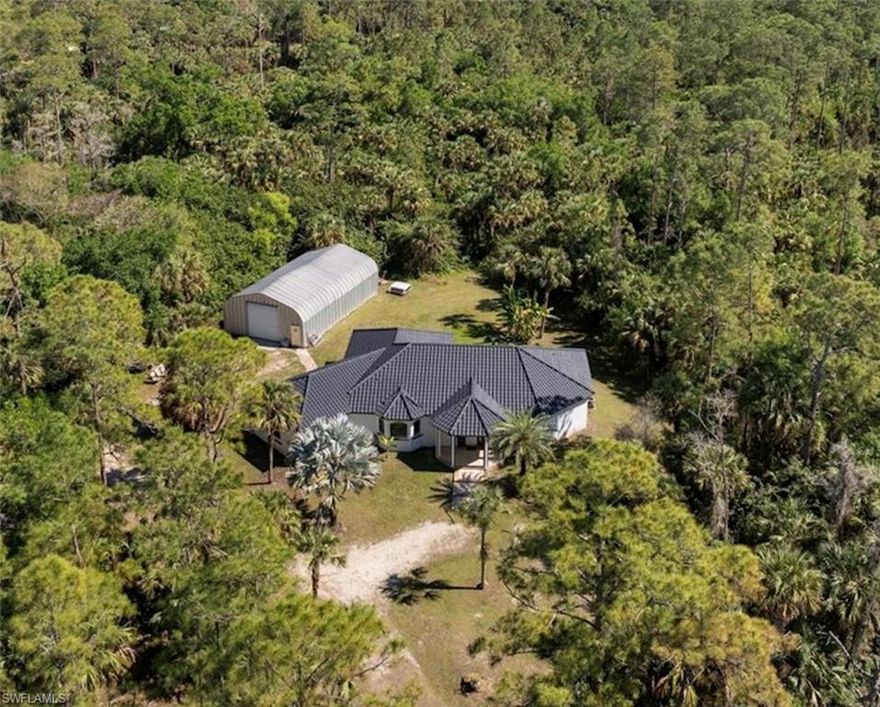 Don’t miss this incredible chance to own a  5.15-ACRE estate in
Golden Gate Estates offering endless possibilities. Property Highlights: Expansive 5.15-acre lot with a scenic pond & the option to subdivide / 1,450 sq. ft. WORKSHOP with electricity & plumbing ready for installation / Provisions for a pool & RV hookup/ Attached garage with conversion potential- create an efficiency apartment or extra bedroom/Two separate driveways on a spacious corner lot for added convenience. Home Features: Vaulted ceilings & a stunning 14-ft. cathedral grand room / Thermal glass French doors & Windows for Safety & efficiency / Two air conditioning units for ideal climate control. This is your chance to secure a prime estate property with incredible potential.