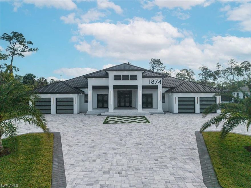 Architectural elegance. Craftsmanship. Innovation. Step into a world of modern elegance in this extraordinary 2026 custom-built luxury residence featuring 5 bedrooms and 5 full bathrooms. Thoughtfully designed for those who value both luxury and privacy, this exceptional home offers a private retreat surrounded by natural beauty. Architecturally striking and unmatched in quality and attention to detail, the residence offers 4,403 square feet under air and over 7,500 total square feet of living and entertainment space. The expansive floor plan features soaring 12-foot ceilings, abundant natural light, and elegant finishes throughout. Designed with both lifestyle and functionality in mind, the property includes a 4-car garage and extensive additional parking, ideal for car collectors, boat owners, and RV enthusiast. The outdoor living space is a true private oasis. The outdoor living area is designed for entertaining and relaxation, featuring a saltwater pool and spa with heater, a fully equipped outdoor kitchen, and an outdoor sound system powered by Sonos, creating the perfect atmosphere for gatherings or peaceful evenings under the Florida sky. The meticulously landscaped 2.6-acre 100% upland lot is adorned with Silvestre and Canarias palm trees and hundreds of plants, all maintained by a sprinkler system and landscape lighting. Breathtaking views can be enjoyed after Florida’s famous sunsets. This property also offers the rare opportunity to build a guest house, workshop or a barn-dominion on the unused acreage. Technical highlights include two zoned AC systems, motorized bug screens, glass garage doors, lift masters garage openers wifi controlled ,keyless entry locks, and integrated smart home automation allowing convenient control of lighting, climate, and other features. A motorized entry gate with intercom adds an additional layer of convenience and security. Inside, the home features a premium Kitchen-Aid appliance package, a spacious walk-in pantry with an additional refrigerator, elegant wall wine display storage, electric screens on the lanai, and electric shades in the bedrooms. Expansive sliders with symmetrical windows create a seamless indoor-outdoor flow and fill the living spaces with natural light. The luxurious primary suite includes a customized walk-in closet with jewelry trays, shoe shelving, and built-in cabinetry. A designer lighting package throughout the home includes ceiling fans, ambient lighting, recessed lighting, and illuminated mirrors. Ideally located just minutes from Naples Beaches  , major hospitals, top-rated schools, shopping centers, grocery stores, and approximately five minutes from Interstate 75 ,this exceptional estate offers both convenience and privacy. With no HOA fees, this spacious property provides a rare opportunity to enjoy luxury living with complete freedom. This home is more than a residence, it’s a lifestyle of comfort, elegance, and unparalleled luxury