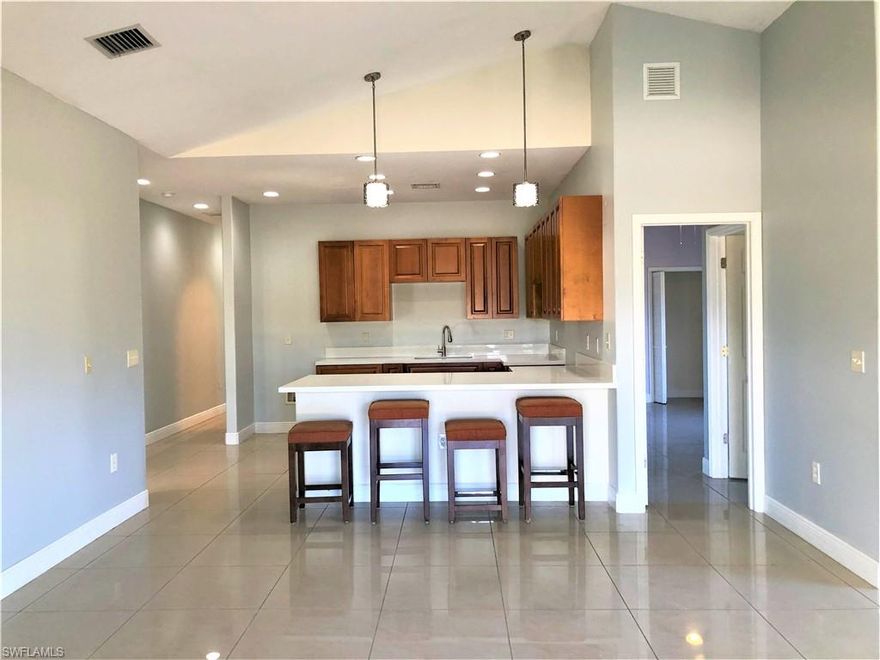 THIS IS THE ONE! Come and fall in love with this beautifully-renovated CBS home on a 1.25-acre lot in a desirable location in Montura Ranches! With almost everything BRAND NEW, this beauty is a "gem" you don't want to miss. This property features a BRAND NEW KITCHEN with stunning quartz countertops, elegant cabinets and BRAND NEW appliances. All bathrooms were recently redone with BRAND NEW toilets and vanities. It also has a BRAND NEW A/C, BRAND NEW tankless water heater, BRAND NEW lights and ceiling fans, and a BRAND NEW interior and exterior paint.  This beauty boasts of gorgeous porcelain tile floors throughout for easy care and maintenance and a spacious master bedroom which has its own den/sitting room inside. Need more space? No problem!  It has a huge finished open porch (39x17) in the back, which offers lots of potential uses. THIS ONE IS A STEAL! Call now for your private showing!