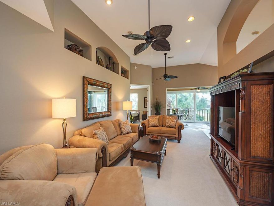 C.15777 - Start living a vacation lifestyle in Shadow Wood! This pristine 2nd floor end unit with great views is being offered fully furnished. So tastefully decorated and NO PROJECTS!  BRAND NEW  A/C Unit & Water Heater! The bright kitchen has white cabinets with wine rack, new Quartz Counter Tops, new stainless sink and faucet. The huge sliding doors lead to a spacious lanai over looking the golf course and lake. The lanai offers both screens and storm proof glass to enjoy year round. Large master bedroom and bathroom with plenty of storage plus an over sized bonus room for multiple uses.Palmetto Ridge homeowners have their own private pool and clubhouse just down the street. Membership for The Commons Club at The Brooks and Shadow Wood Country Club are available but not mandatory.