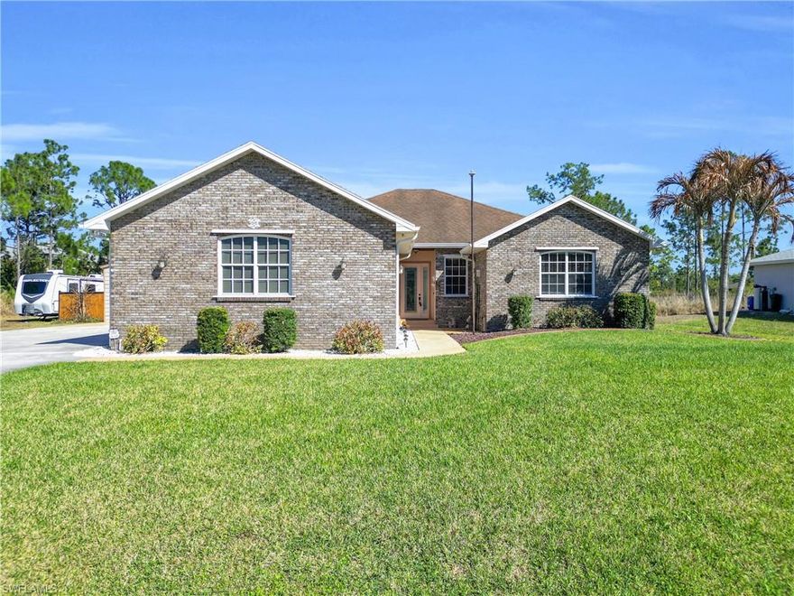 Stunning  4 bedroom 2 baths and 3+ car garage residence on a full 1-acre lot, offering space, privacy, and peaceful surroundings. Built in 2012 this Custom-Built Brick Estate Home is one of a kind beautifully hand crafted. Made from over 18,000 hand laid real moss bricks. New owner will love the open-concept layout, spacious living room flows into a modern kitchen with granite countertops, stainless steel appliances and large island for family gathering. 10-Foot-high ceilings, lots of crown molding, 8' high interior doors, 2172 Sq Ft of Living area.  Stunning hand scraped cherry real wood floors, breakfast area with bay windows.  3 air conditioner units for efficient climate control, surround sound, wood shelves in all closets, 50-amp RV electric Plug. Entire house offers the best reverse osmosis system. Step outside to your own private paradise. Sparklin pool and a cozy bonfire seating area creates the perfect evening gatherings. Massive 24x30 enclosed insulated metal building with endless possibilities ideal for workshop, RV or boat storage customize with electrical panel and mini split unit on a concrete slab. full acre completely fenced. You will be wowed!