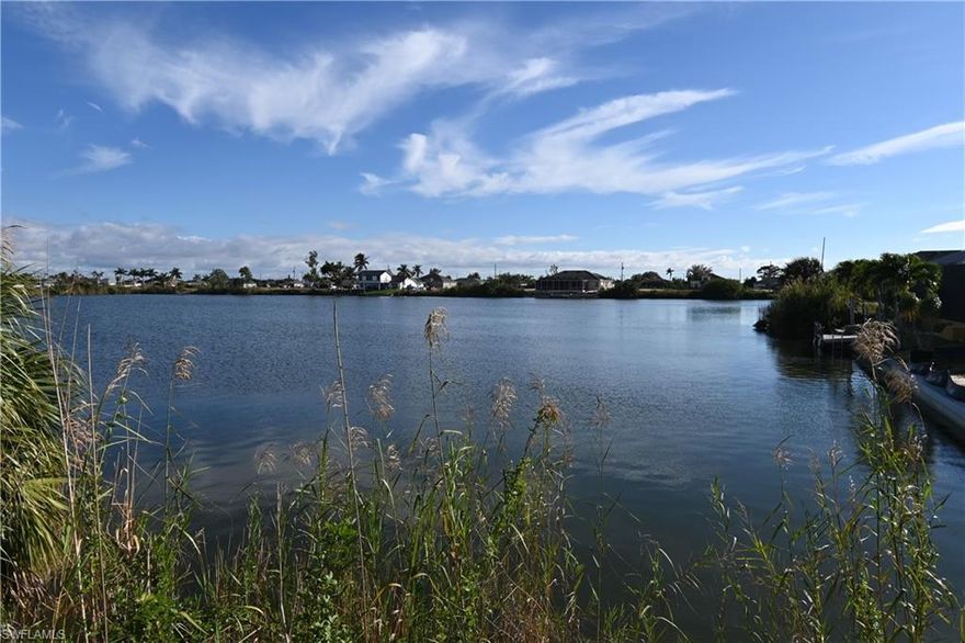 Beautiful south exposure freshwater lot on Pelican Lake with an almost 1000 ft view across the water. Build your home and enjoy maximum sun on your future pool. Go kayaking, paddleboarding, fishing, jetskiing and more. Quick access to Chiquita Blvd and Diplomat Pkwy and just minutes away from Coral Oaks Golf Course.