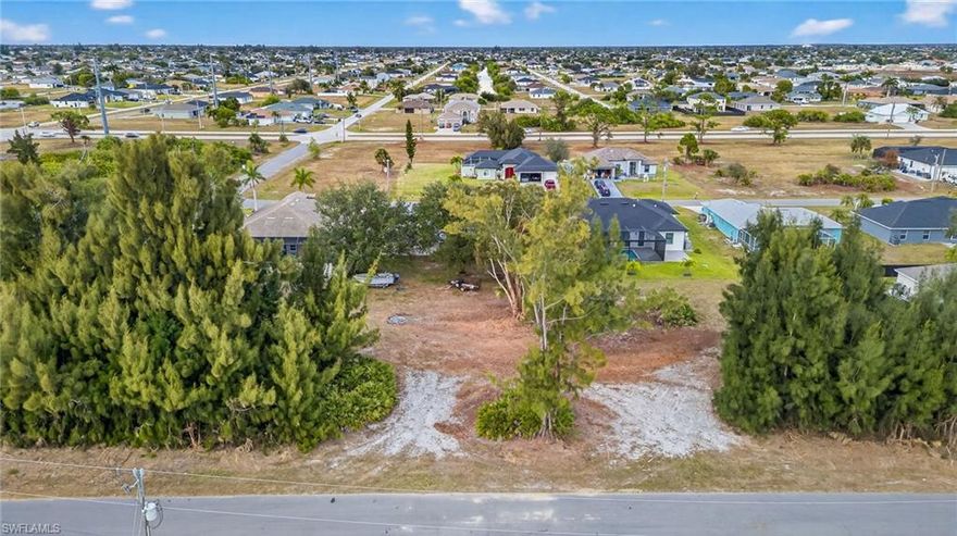 Rare triple lot available in the developing SW Cape Coral area. With approximately 5,130 sq ft, this vacant parcel offers strong potential for future growth and development. Ideal for builders or investors looking to get in early in a rapidly expanding neighborhood. Conveniently situated near shopping, dining, and schools. Don’t miss your chance to secure a prime piece of land in one of Cape Coral’s fastest-growing areas.