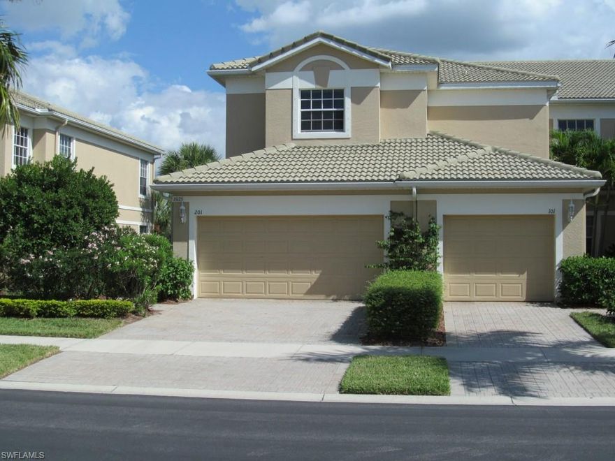 RARELY AVAILABLE is this 2nd floor, 4 br/2 ba end unit condo with lake view, and over 2000 sq ft under air, plus an oversize 2 car garage. Upon entering the great room, your focus is immediately drawn to the lanai overlooking the lake, with an unobstructed 180 degree view of the gate house, amenity center, and community. Only a few units have this eye-catching scene! Entrance to lanai off 3 separate living areas. The open concept great room plan gives easy access to all areas of the house in a strategic laid out fashion. It is located in the  center of the home, and just a couple of steps to any room off this area. A winning floor plan!  Other features include a jack-n-jill bath, tile in the main living areas, new ss kitchen appliances within the past year, custom backsplash, and a huge walk in closet in the master br. A walk to the clubhouse in about 2 minutes. Sidewalks on both sides of the street, with an amenity center that is second to none. 2 gated entrances provide easy access to the community. Just minutes from Ft. Myers Beach, Sanibel, shopping & recreation. Low condo & HOA fees. The pride of ownership shines forth from all owners in this master planned gated community.