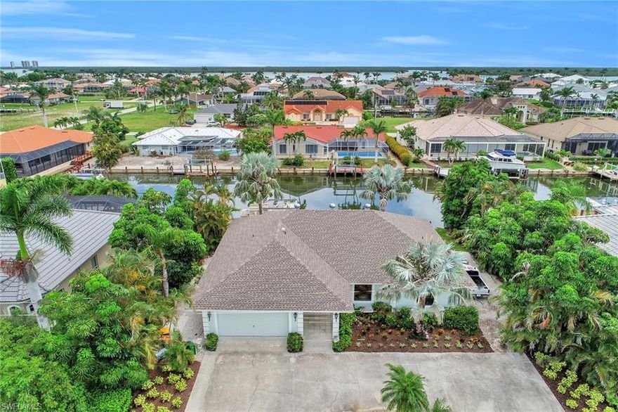 Welcome to this three bedroom well maintained residence in excellent condition and offering an open floor-plan featuring vaulted ceilings, updated kitchen and baths, granite counter-tops, breakfast bar, pantry, freshly painted interior, two master suites, and spacious open tiled lanai for entertaining and enjoying the lovely canal views. Adventure out for a great day of boating or fishing with fast water direct access to the River and Gulf of Mexico from your 70’ dock with 10,000 pound lift. Additional features included are a circular driveway for plenty of parking, manicured landscaping, manual shutters, new roof installed 2018, and air conditioner replaced in 2016. Home already on city sewer. This is a real gem to complement your Marco Island lifestyle.