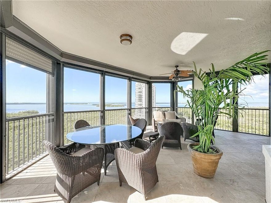 Spectacular panoramic views of the Gulf and Bay await you from this 10th floor professionally designed residence in the highly desirable Palermo at Pelican Colony. The balcony is very spacious and includes electric hurricane shutters There are beautiful travertine and Brazilian cherry hardwood floors in the main living areas. This unit  also includes a rarely available oversized private two-car garage conveniently located directly outside of the garage lobby. Private elevator entry from the unit. Large laundry room with storage cabinets. Great floor plan with 3 bedrooms and 3 full baths. This property is offered as turnkey furnished and is move-in ready! Palermo features a resort-style pool with spa, fitness center, recently renovated social pavilion with full kitchen, two guest suites and a theater. The building is immaculately maintained and recent improvements include a new roof, new exterior paint and remodeled elevator lobbies. Your private membership at Pelican Colony includes access to the Bay Club where you can enjoy both casual and formal waterfront dining on two levels as well as many social events. Another featured amenity is boat shuttle access across the bay to the pristine 34-acre beach park. The community also offers many other activities including a Kayak and canoe park, pickleball, tennis, bocce, a fitness center and so much more. The Colony Golf Club also has optional golf and sports memberships available. Palermo is in a great location just 1.5 miles from Coconut Point Mall and close to many excellent dining, shopping and entertainment options.