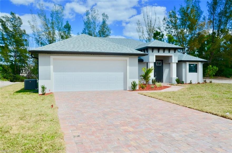 This beautiful gulf access new construction home features 3 bedrooms plus den/4th bedroom, and 2.5 baths with over 2000 square foot of living space. The interior boasts gorgeous espresso colored cabinets with slow close drawers and doors in the kitchen which includes a large island, pantry, custom glass mosaic backsplash, and stainless steel appliances. Master bedroom features tray ceiling, his/her walk in closets, and sliding glass door to lanai area. The spacious master bath has dual vanities, stand alone modern tub, walk-in shower with custom accent tile, and separate stool room. Other interior upgrades include: impact window/sliders, tray ceilings in all bedrooms, diagonally laid tile throughout, custom mirrors and lighting in baths, built in cabinets in laundry room, wood shelving in closets, glass panel entry door to den, 5 panel doors, and half bath off 3rd bedroom that can be utilized as a pool bath. The stunning pool has iridescent glass water line tile and sun shelf with bubblers. The large under truss lanai with custom built-in kitchen is great for entertaining while enjoying the breathtaking Florida sunsets. Grab your boat and call this beauty home.