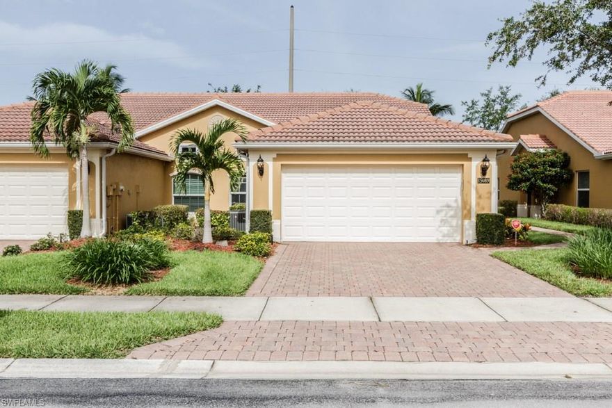 This is one home you can't pass up.  3 bedroom 2 bath move-in ready villa with a heated pool.  Very short walk to the Community Center and to all community amenities including the 7,000 square foot clubhouse with fitness room, card room, billiards room, child-friendly pool and play area, basketball and tennis court. This villa features white cabinets, stainless steel appliances, Corian countertops, tile flooring in the kitchen, foyer area and bathrooms, carpet in the living room and bedrooms, vaulted ceiling, decorative plant shelving, screened lanai with a quiet view plus a salt water pool system and heated pool. HVAC system is only 6 months old - pool heater 3 yrs old.  - Great school district, minutes to shopping, short drive to I-75, 15-20 minutes to Vanderbilt Beach, and Pets Welcome!