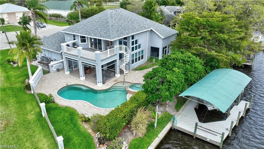 Welcome to Alva – The Secret Equestrian & Boater’s Recreational Hideaway Discover where refined waterfront living meets unspoiled Old Florida beauty. Tucked along the scenic Intracoastal Waterway, this extraordinary riverfront estate delivers the perfect balance of luxury, privacy, and adventure. Wake each morning to breathtaking sunrises shimmering across the water from your expansive primary suite—your own private sanctuary framed by panoramic river views. The grand great room, adorned with soaring windows and powered blinds, is bathed in natural light, creating a bright, open ambiance ideal for elegant entertaining or relaxed everyday living. Step outside into your personal resort: a sparkling pool and spa overlooking the river, where you can unwind under the Florida sun as impressive yachts cruise by. Every detail invites you to slow down, breathe deeper, and savor the moment. Assumable flood policy. New generator still in the box. Furnishings, art and garage items stay with the home. A new roof and septic system (2022), plus numerous thoughtful updates, this residence offers peace of mind and effortless move-in readiness. Surrounded by sprawling estates and near equestrian-friendly spaces, this property isn’t just a home—it’s a lifestyle tailored for boating enthusiasts, horse lovers, and anyone seeking a serene waterfront retreat. This is where luxury meets nature. This is where privacy meets possibility. Don’t just imagine the life—live it. Schedule your private showing today and experience one of Alva’s most captivating waterfront offerings.