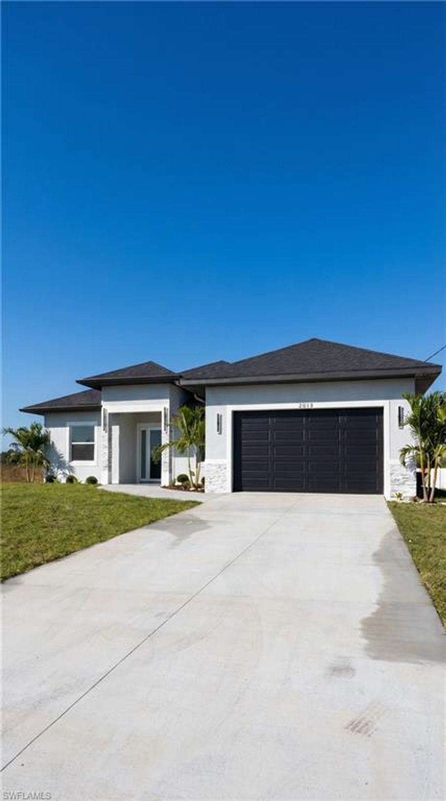 Please note: Photos shown are of a similar model. Colors, finishes, and interior design are subject to change. Home is currently under construction. This spacious residence features 3 bedrooms + a versatile den, ideal for a home office, flex space, or even a guest room to fit your lifestyle needs

Be the first to own this stunning, thoughtfully designed new construction home offering the perfect blend of modern style and everyday functionality.

Step inside to an open and airy layout featuring 10-foot ceilings and elegant porcelain tile flooring throughout, creating a seamless and sophisticated look. The heart of the home is the beautifully designed kitchen, showcasing 96” cabinetry, sleek finishes, and stainless-steel appliances, including a double oven, perfect for entertaining or everyday convenience.

The primary suite is a true retreat, complete with a walk-in closet featuring cabinetry and a luxurious ensuite bathroom offering dual sinks, a soaking tub, and a separate shower.

Enjoy Florida living at its finest with a covered lanai and fully equipped outdoor kitchen, ideal for relaxing evenings or hosting gatherings year-round.

This home combines quality craftsmanship with modern upgrades, don’t miss the opportunity to make it yours before completion!