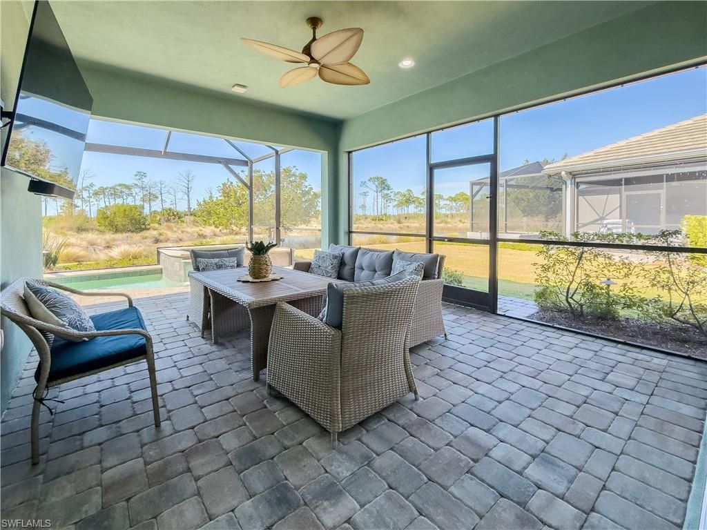 Photo of 6399 NEGRIL ISLE DR, NAPLES, FL 34113 (MLS # 226009325)