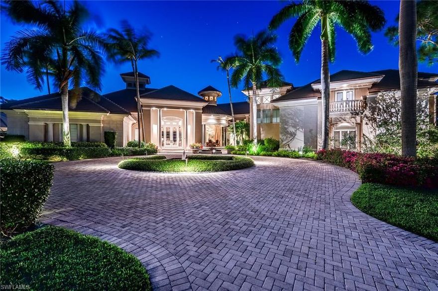 Current events and today's lifestyle require additional space for home offices, entertainment, exercise rooms and private areas for family members and guests. This estate home is the solution. A timeless masterpiece by Harwick Homes begins at the entry to this unique home where walls of glass open to nature; koi ponds, lush tropical landscaping and expansive outdoor living areas. The main level includes living room with keystone fireplace, library, formal dining room and butler's pantry. An impressive kitchen with oversized island and work areas opens to the family room. A theater with comfortable seating for eight or more provides another venue for entertaining. The beautiful fountain with water feature invites you to the stunning master suite and private sitting area with fireplace. Vanishing 10-foot sliding doors open to the lanai with oversized infinity pool, spa, fireplace, outdoor kitchen, and bar that overlook lake and golf course. The gallery leads to a private elevator taking guests to the four en-suite bedrooms. Balconies and sundeck offer captivating views. A separate guest house with terrace provides privacy and comfort. Quality architectural details throughout.