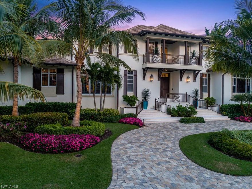 Located steps from the beach in the exclusive neighborhood of Aqualane Shores, this magnificent British West Indies-styled home is being sold turnkey in like new condition. Designed by Stofft Cooney Architects, this magnificent residence features a bright open floor plan with indoor living areas seamlessly flowing into outdoor space, creating a year-round tranquil oasis overlooking the pool and lake.  Situated in a rarely available and coveted lot boasting 150 foot of frontage on Gulfshore Boulevard South and 87 feet on 17th Avenue South, the property has two separate entrances and is just a stone’s throw away from the Gulf of Mexico.  Ground floor master suite and four guest bedrooms with en suite baths offer a luxurious and comfortable living space for family and guests. Highlights include vaulted ceilings with beautiful wood detailing, wide plank dark wood floors, and gorgeous sunset views from the second-floor balcony each evening.