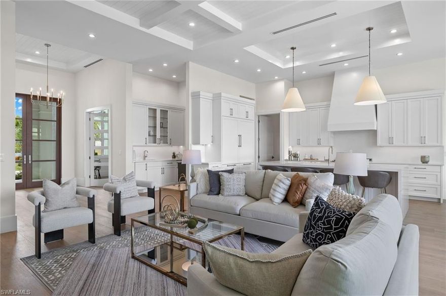 Introducing a special opportunity to purchase a luxurious 4 bedroom plus den, 4.5 bathroom new construction property in the extremely sought after neighborhood of Lake Park, located on a quiet street and just minutes to 5th Avenue. As you enter the home, notice an incredible open floor plan featuring soaring, 12 foot ceilings with exquisite tongue and groove detail. The stunning chef's kitchen is highlighted by paneled appliances, a massive island, custom shaker style cabinets, a 6 burner gas range, a separate wet bar, and butler's pantry for extra storage space. With beautiful wide plank wood flooring, gorgeous tiles in each bathroom, detailed coffered ceilings, contemporary hardware, high end plumbing fixtures and meticulous trim work throughout the residence, no detail was overlooked. The outdoor space is an entertainer's dream, featuring an outdoor kitchen, outdoor TV area with fire place, travertine pool deck, and convenient roll down screens. With lush landscaping and a generous yard space beyond the pool, this home must be seen in person to appreciate. The evolving Lake Park is a short distance to everything Naples has to offer. Superb quality w/out the Olde Naples pricing. Recent winner of "Lake Park Home of the Month!"