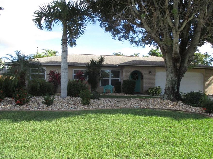 Wow, desirable SAVONA neighborhood.  So many upgrades in this saltwater, solar heated, POOL home..nearly $100K worth.  This home is perfect for outside entertaining and enjoyment.  The lanai runs the length of the house and features a HUGE pool, hot tub, summer kitchen, brick pavers, landscaping inside the lanai area, pool bath and outside storage.  Plus, there is plenty of room for seating, tables, etc. Kitchen has granite, stainless appliances, wood cabinets, modern lighting, and attractive back splash.  Home is tiled throughout. Bathrooms are updated.  The master bedroom sports a door to the lanai.  Roof, replumb, and kitchen were all done in 2013.  A/C was replaced in 2015.  Its really all done for you here.  Home sits across the street from 1 million $$ plus waterfront homes.  Enjoy the waterfront community without the waterfront prices.