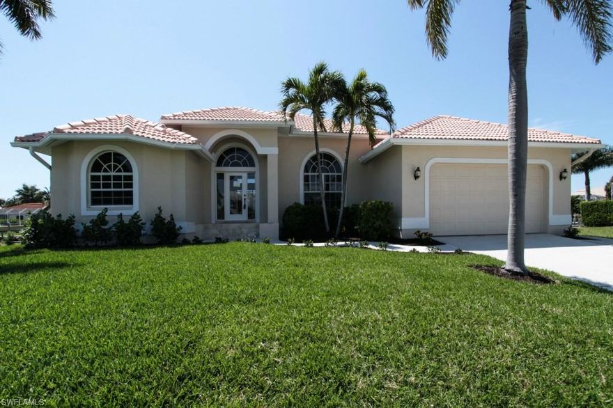 Attractive 3BR/2BA water indirect CBS pool home with tile roof showcasing a beautiful updated kitchen with granite and SS appliances, updated baths, crown molding, soaring ceilings and cofferred ceilings in master, 24" tile on diag, fresh paint in andout, new carpet, new pavers around pool on lanai and down to dock.  Dock has 16,000 lb lift with water and elect.  New lawn, landscaping and irrigation system and more!