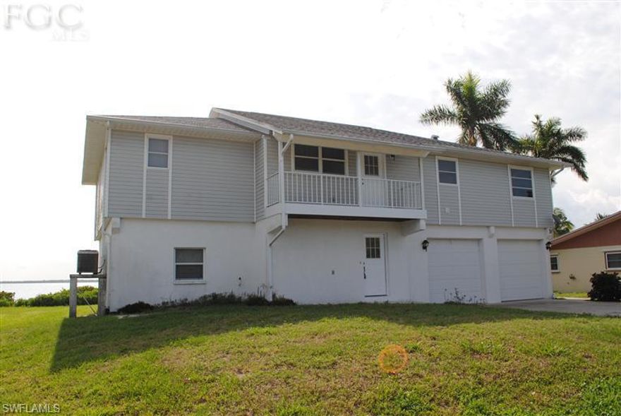 Gorgeous, unobstructed panoramic view of Matlacha Pass!  3 bdrm, 2 bath stilt home is one of only 5 homes located on a quiet dead end street in Tropical Point with access to Lee County kayak/small craft launch.  Well-built concrete block structure features vaulted ceilings, spacious rooms and screened porch that runs the length of the house.  Beautiful views from the entire rear of the home, large wooded parcel at the front. Two car garage beneath with plenty of storage.  Use the dumb waiter in the garage to transport your groceries to the upper level.  With a little updating this could be your dream home! *Portion of the Lee County Park runs along the front edge of property. Mangroves are kept at 6 feet maintained by the county.*