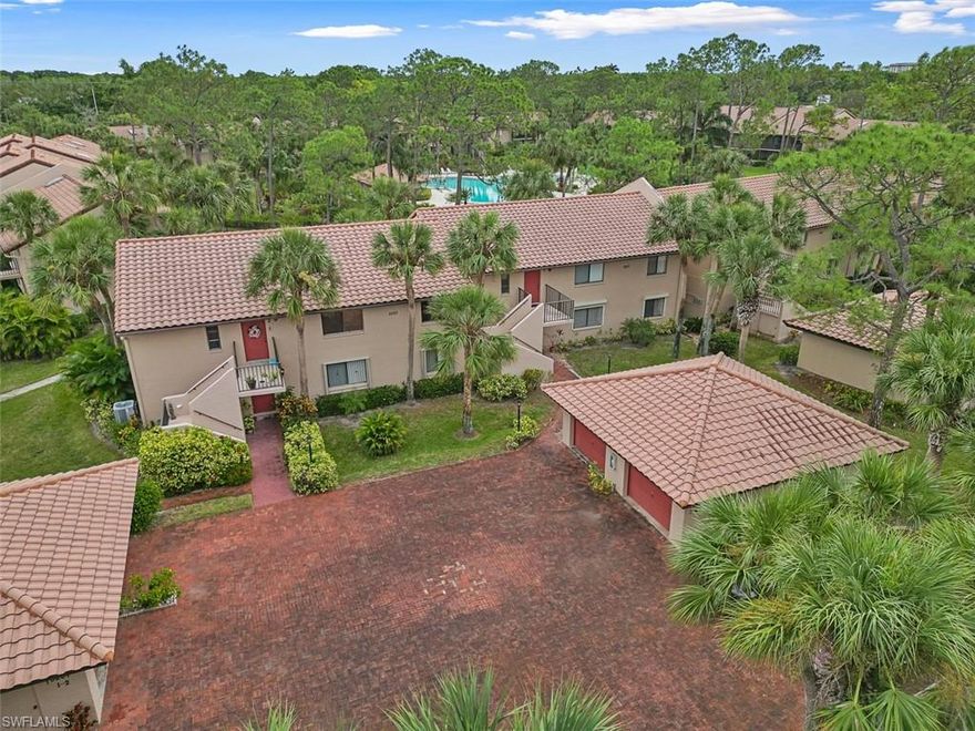BRING AN OFFER!  Welcome to this charming first-floor condo nestled in the heart of Naples, just 4 miles from the soft sands of Lowdermilk Park and Naples Beach. Located in the exclusive Coach House Community, this home is one of just 50 units, offering a peaceful, non-gated neighborhood surrounded by lush, tropical landscaping.  The beautiful pool area is a tropical oasis. 

Inside, you’ll find 1,458 sq ft of living space, featuring brand-new floating laminate tile flooring that flows seamlessly throughout. The large main bedroom is a retreat, complete with built-in shelving, an oversized closet, and direct access to the enclosed lanai. The updated ensuite bathroom boasts dual sinks and a walk-in shower, while the no-popcorn ceilings give the home a modern touch.

The kitchen is both functional and inviting, featuring granite counter-tops with stainless steel appliances.  Wood cabinets, and an eat-in breakfast nook with a built-in desk for extra workspace. A spacious enclosed lanai with tile flooring overlooks the community pool, perfect for relaxing with your morning coffee or evening drink.

Additional highlights to the condo include:
The home was repiped in 2021.
Detached single-car garage with extra storage.
Newer A/C (2018) and water heater (2017).
Electric hurricane shutters for added peace of mind.
Washer and dryer conveniently located in-unit.
Ability to rent twice a year for 30 days each—ideal for seasonal residents or investors.
HOA fees include nearly everything you need, covering cable, WiFi, water, sewer, trash, exterior pest control, landscaping, insurance, and more. One pet under 35 pounds is welcome!

With its unbeatable location nearby to all of what Naples has to offer, low-maintenance lifestyle, and proximity to the pool, this home is ready for its next chapter. Whether you're searching for a full-time residence, a seasonal getaway, or an investment opportunity, this property checks all the boxes.

Don’t miss your chance to own this hidden gem—schedule your private showing today! Florida is on SALE!
