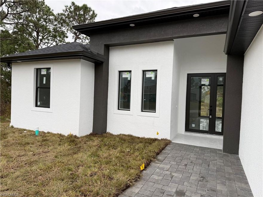 Seller contributes $10,000 toward closing costs! This spacious home is perfect for a large family or as an investment property. Featuring four bedrooms and three full bathrooms, including a versatile game room / mother-in-law suite with a wet bar and large private shower, it’s ideal for Airbnb or multi-generational living. Enjoy a modern kitchen with quartz countertops, a large island, and elegant wood cabinetry, plus 32x32 porcelain tile and coffered ceilings throughout. Impact windows and doors, a wide paved driveway and entry, and a private backyard with automatic sprinklers provide comfort and security. The rear canal offers privacy (currently dry), and outdoor kitchen ready (hookups and drain installed only) Built with exceptional quality that stands out the moment you walk in — don’t miss this opportunity!

El vendedor contribuye con $10,000 para los gastos de cierre! Esta amplia casa es perfecta para una familia grande o como propiedad de inversión. Cuenta con cuatro habitaciones y tres baños completos, incluyendo un versátil cuarto de juegos / suite para suegros con wet bar y una amplia ducha privada, ideal para Airbnb o vivienda multigeneracional. Disfrute de una cocina moderna con encimeras de cuarzo, una gran isla y elegantes gabinetes de madera, además de pisos de porcelanato 32x32 y techos artesonados. Ventanas y puertas de impacto, una entrada y driveway pavimentado amplio, y un patio trasero privado con sistema de riego automático ofrecen comodidad y seguridad. El canal trasero brinda privacidad (actualmente seco) y la cocina exterior está lista con conexiones y drenaje instalados. Construida con calidad excepcional que se nota desde el primer momento — ¡no pierda esta oportunidad!