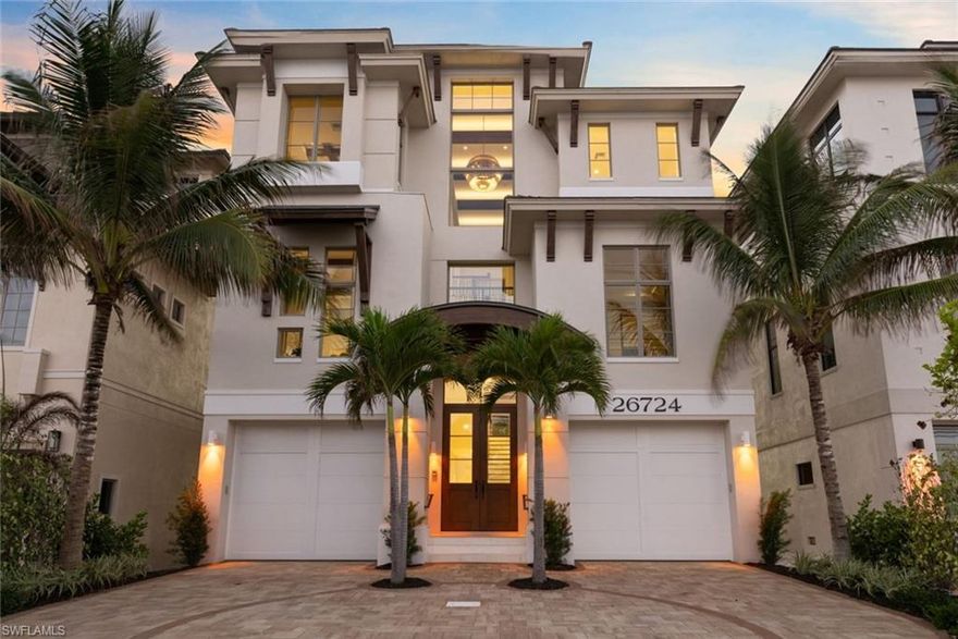 Imagine waking up to the breathtaking beauty of Bonita Beach—this is the dream home you've been waiting for. Built in 2020 by award-winning Potter Homes, this fully furnished, meticulously maintained residence feels brand new, allowing you to avoid lengthy new construction wait times. Every detail has been thoughtfully designed for both relaxation and entertainment, creating the perfect balance for your lifestyle. With six ensuite bedrooms and eight bathrooms spread across nearly 5,500 square feet, there’s plenty of room to make unforgettable memories with family and friends. Picture yourself taking in unobstructed views of the beach and gulf beyond. The sunsets here are like watercolor masterpieces. Inside, you'll find custom touches that elevate every space, from the warmth of white oak floors in the living areas to the elegance of a fully enclosed wine room and wet bar. The kitchen is a chef’s dream, featuring top-of-the-line Thermador appliances, a step-in pantry, and a massive island with seating. Control4 automation ensures effortless modern living with convenience at your fingertips. Car enthusiasts will love the six dedicated garage spaces, with room for lifts, providing ample space for your private collection or any toys you can imagine. And with comprehensive storm protection, you can rest easy knowing this home is designed to handle even the harshest weather. Conveniently located just 30 minutes from RSW and Naples Airport, close to shopping, dining, and entertainment, and mere steps from the white sands of Bonita Beach, this home truly offers it all. With so many upgrades and features, it’s best appreciated in person—schedule your private showing today and see for yourself.