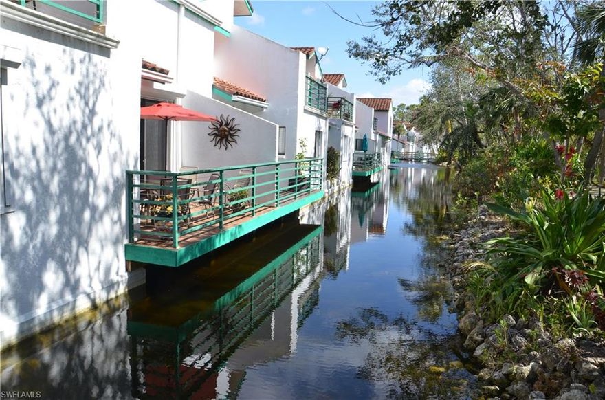 A community like no other in Naples - a must see.  Lush Nature Trail and every balcony/deck overhanging water.   On a tropical landscaped lagoon with private deck.  First floor end unit with attached garage.  Hurricane shutters.  Kitchen with granite counter tops and an adjacent breakfast room.  Soaking tub and dual sinks in the master.  Sun room and dining room offer flexibility. Resort style pool & spa.  Gulf access from the boat docks and a kayak/canoe rack.  A short walk or bike ride to  the Greenway, which connects North to the Conservancy/Zoo and South to the projected  Baker Park and Olde Naples.  Only minutes by car to 5th Avenue.  All dimensions and information are provided by third party sources, are approximate and should be verified by the buyer