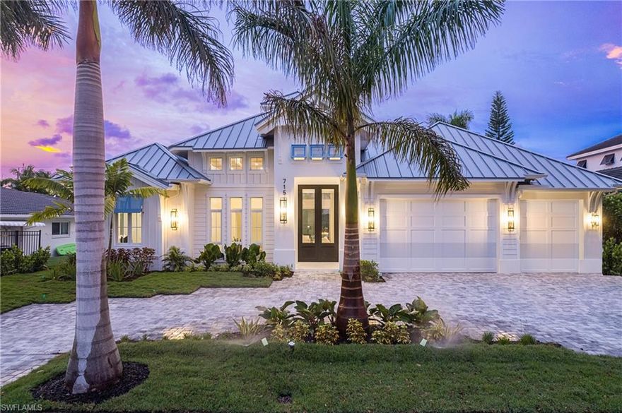 This Coastal Charmer has exquisite architecture and beautiful details throughout. Welcome home as you enter through stunning 12 ft front doors, Open plan with high ceilings & ceiling details including beams, woodwork and coffered finishes. Lavish kitchen with handmade white & oak cabinetry, opulent quartz countertops, wine refrigerator, top of line appliances, natural European oak floors, family room has stunning vapor fireplace & open ceiling details, custom double slider doors open to convenient office/den, owner's suite with large sitting area and coffered details, ensuite will not disappoint with soaking tub, generous shower and sizeable custom closets, your guests can escape the mundane in the guest suite with direct access to pool and private pool shower, all bedrooms have ensuite baths. Luxury pool has stunning built in firepit, waterfall designs, luxury spa and lounge area. Lanai is the perfect outdoor entertaining space, has retractable screens & hurricane shutters, fireplace and kitchen area. Just minutes from 5th Avenue & the private Moorings white sandy beach access. Not a mandatory flood zone no flood Ins. required. This site not effected by hurricane Ian.