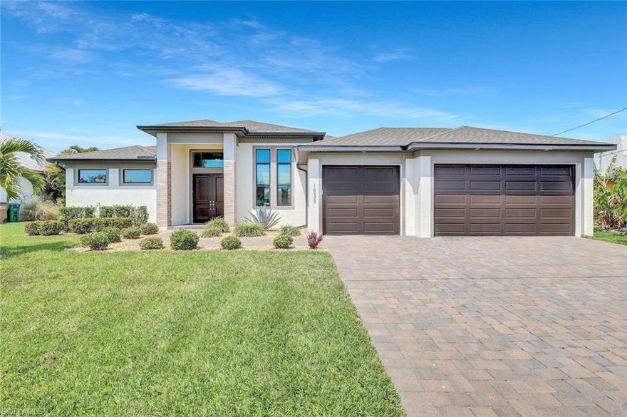Prepare to be amazed with this modern, custom built, luxury Gulf access, turnkey dream home, completed in 2020 and never flooded. Located in one of SW Cape Coral’s most desirable and quiet boating neighborhoods, situated on a 150 ft wide Canal. Showcasing an impressive walk-around boat dock with a lift that holds up to 14,000 lb, including a 35 ft Canopy, electricity and water, making this a boaters dream. This beauty features 3 modern and airy bedrooms plus a flexible den, 3 bathrooms and a 3-car garage with epoxy flooring. The open-concept living area features a beautiful, modern kitchen with breakfast bar, stainless steel appliances, granite countertops and tiles throughout. The large living room shows a tray ceiling, impact pocket sliding doors are flowing seamlessly to the private screened lanai including a heated salt-water pool and spa. The home comes truly turnkey, fully furnished and beautifully decorated, this is the perfect blend of modern design and Florida waterfront living. The Gulf is just around the corner, just minutes to Cape Harbour, Tarpon Point Marina, Downtown Cape Coral, shops, golfing and entertainment. A home that checks every box, designed for living your best life with style, charm, space, and plenty of room for all your favorite toys. It is perfect for relaxing, entertaining friends and family, and enjoying all your favorite hobbies.